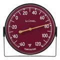 Head-on image of the 104-1512D 5-inch Dial Thermometer with Bracket features a wine red dial with white temperature readings in a Fahrenheit scale from -60 to 120 degrees, with an antique gold pointer shown with the mounting bracket/stand positioned at the bottom