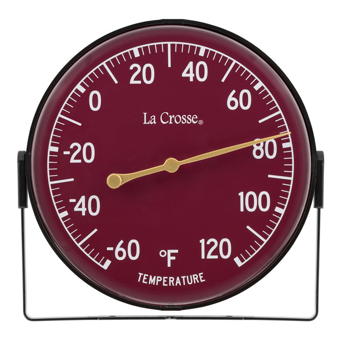 Head-on image of the 104-1512D 5-inch Dial Thermometer with Bracket features a wine red dial with white temperature readings in a Fahrenheit scale from -60 to 120 degrees, with an antique gold pointer shown with the mounting bracket/stand positioned at the bottom