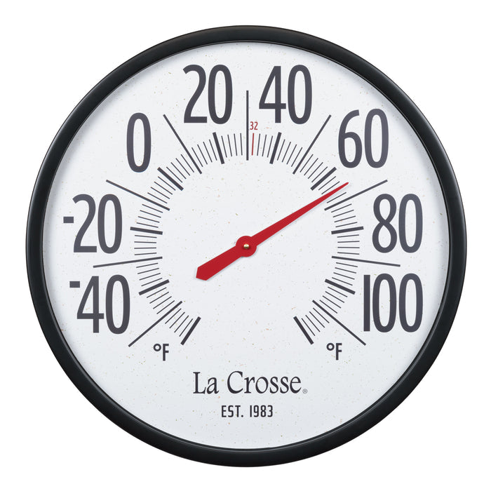 Extra-large oversized circular indoor/outdoor analog dial thermometer measuring 21.80 inches. Black plastic case surrounds a speckled terrazzo white dial and 2.90-inch-tall black numbers ranging from -60 to 120 degrees Fahrenheit. La Crosse logo and “1983” logo are located below the center of dial