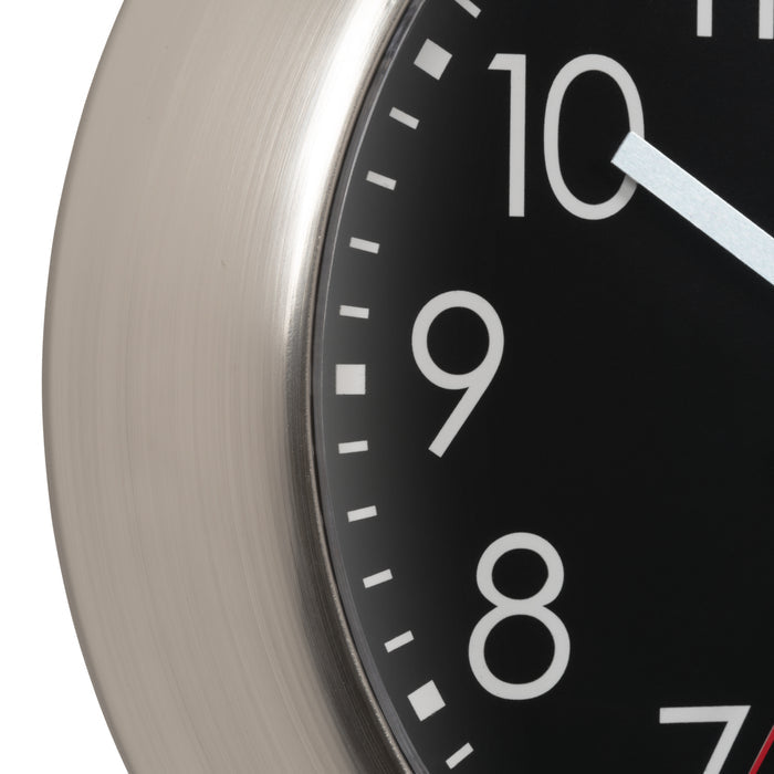 Close-up of a clock face with white numbers on a black background