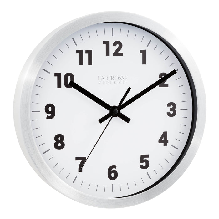 Right facing view of the Nash 404-2626 Wall Clock with a silver metal flush mount frame surrounding a white dial with black numbers, hour, minute and second hands and gray time markings
