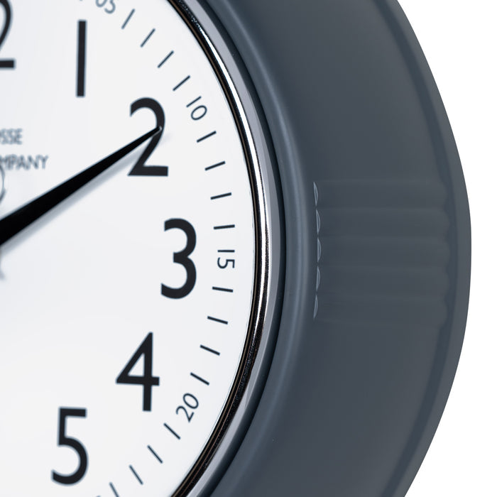 Close-up frame image of the 404-3024DS 9.5-inch Diner Clock – Dark Slate features a retro-style dark slate frame with a white dial, chrome bezel, black numbers and minute markings, black metal hands, and a silver second hand.