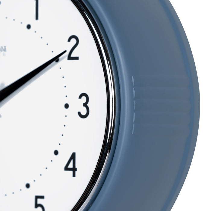 Close-up frame image of the 404-3024IB 9.5-inch Diner Clock – Indigo Blue features a retro-style Indigo Blue frame with a white dial, chrome bezel, black numbers and minute markings, black metal hands, and a silver second hand.