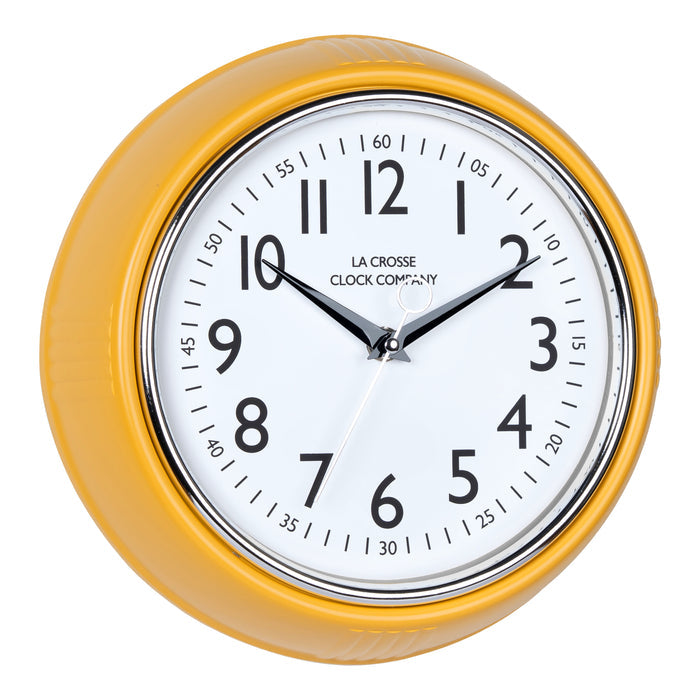 Right-facing image of the 404-3024MY 9.5-inch Diner Clock – Mustard Yellow. The clock features a retro-style mustard yellow frame with a white dial, chrome bezel, black numbers and minute markings, black metal hands, and a silver second hand.