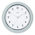 Head-on image of the 404-3024PH 9.5-inch Diner Wall Clock - Pistachio. The clock features an off-white dial with black numbers, pistachio hour dots, pistachio hour and minute hands, and a silver accent second hand set within a vintage-retro pistachio green frame.