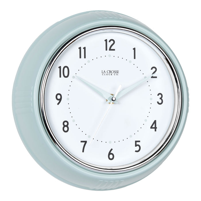 Right-facing image of the 404-3024PH 9.5-inch Diner Wall Clock - Pistachio. The clock features an off-white dial with black numbers, pistachio hour dots, pistachio hour and minute hands, and a silver accent second hand set within a vintage-retro pistachio green frame.