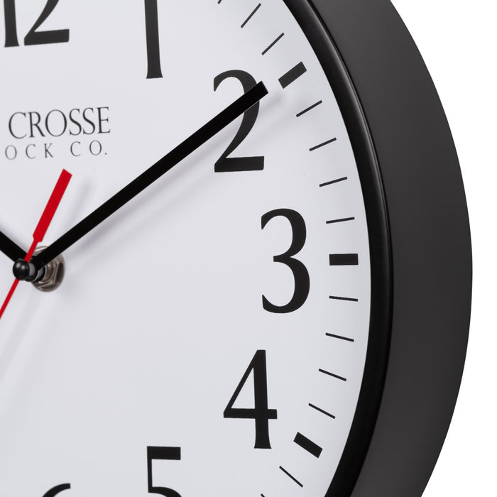 Close-up image of the Black frame of the 404-3025B 10-inch Basic Decor Wall Clock with a white dial, black numbers, hour, minute hands, and a red second hand
