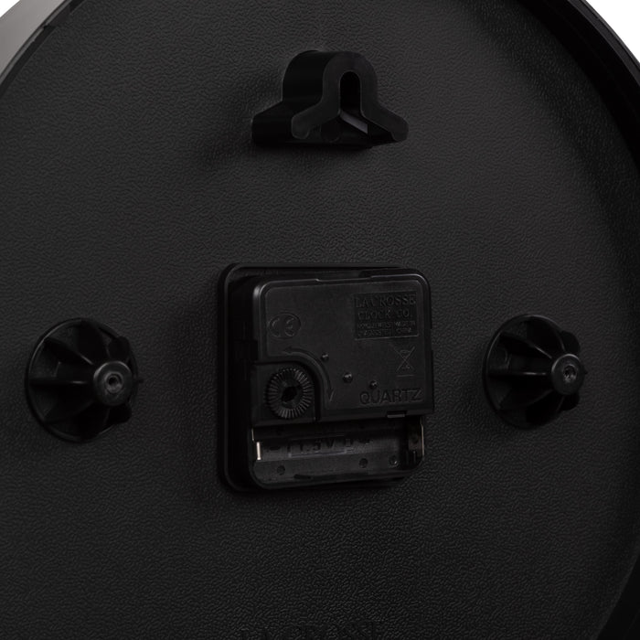 Close-up image of the battery compartment for the 404-3025B 10-inch Basics Wall Clock with Quartz movement and an easy set time wheel