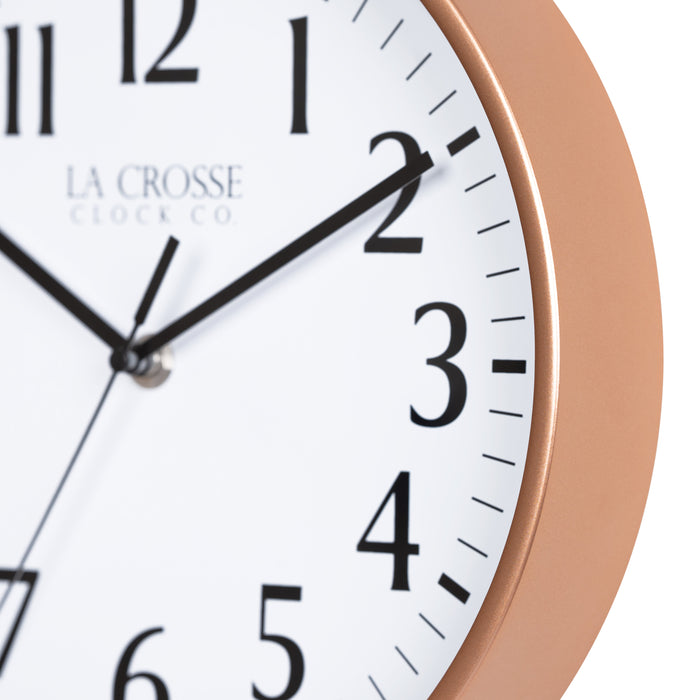 Close-up image of the Copper frame of the 404-3025NB 10-inch Basic Decor Wall Clock with a white dial, black numbers, hour, minute, and second hands