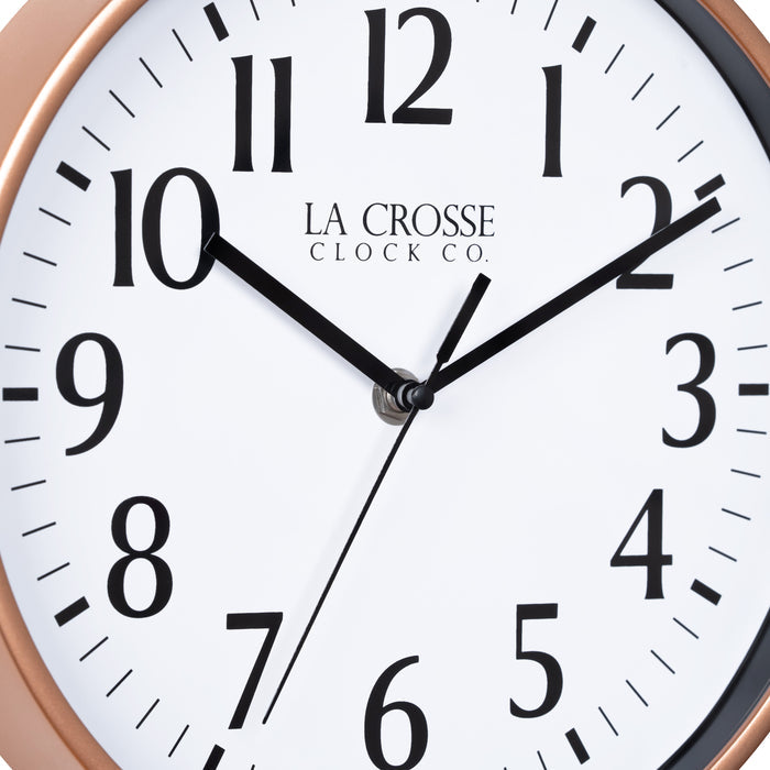 Close-up image of the dial of the 404-3025C 10-inch Basic Decor Wall Clock with a Copper frame, white dial with black numbers, hour, and minute hands, and a black second hand