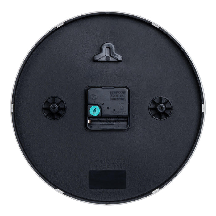 Back image of the 404-3025GB 10-inch Basic Decor Wall Clock showing the hanging hole for mounting, easy set time wheel, the Quartz movement with battery compartment