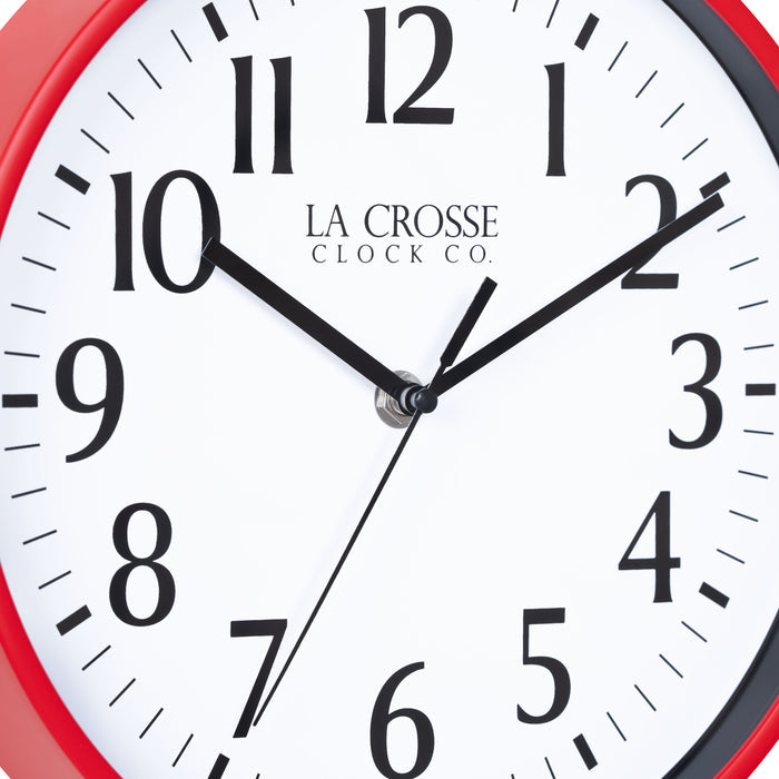 Close-up image of the dial of the 404-3025R 10-inch Basic Decor Wall Clock with a red frame, white dial with black numbers, hour, minute, and second hands.