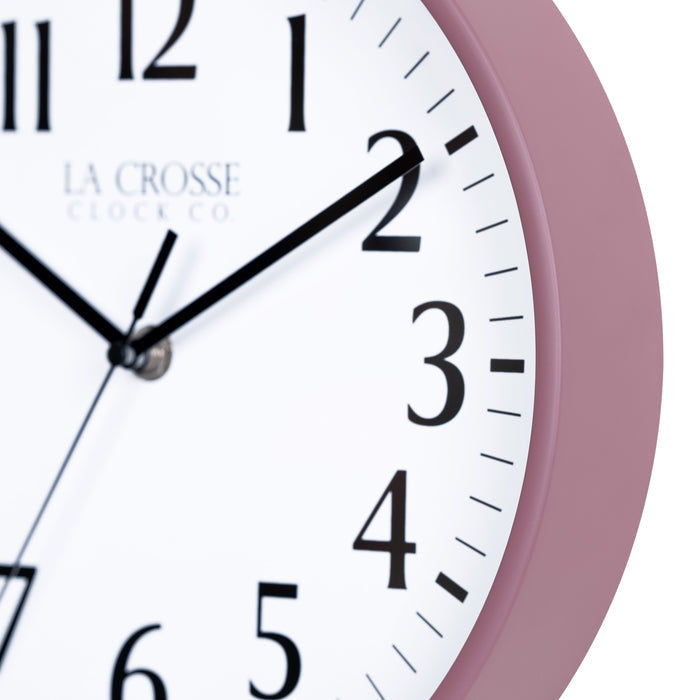 Close-up image of the Ruby Red Rose frame of the 404-3025RR 10-inch Basic Decor Wall Clock with a white dial,  black numbers, hour, minute, and second hands