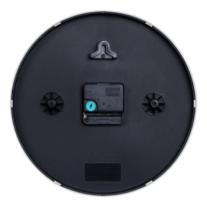 Back image of the 404-3025S 10-inch Basic Decor Wall Clock showing the hanging hole for mounting, easy set time wheel, the Quartz movement with battery compartment