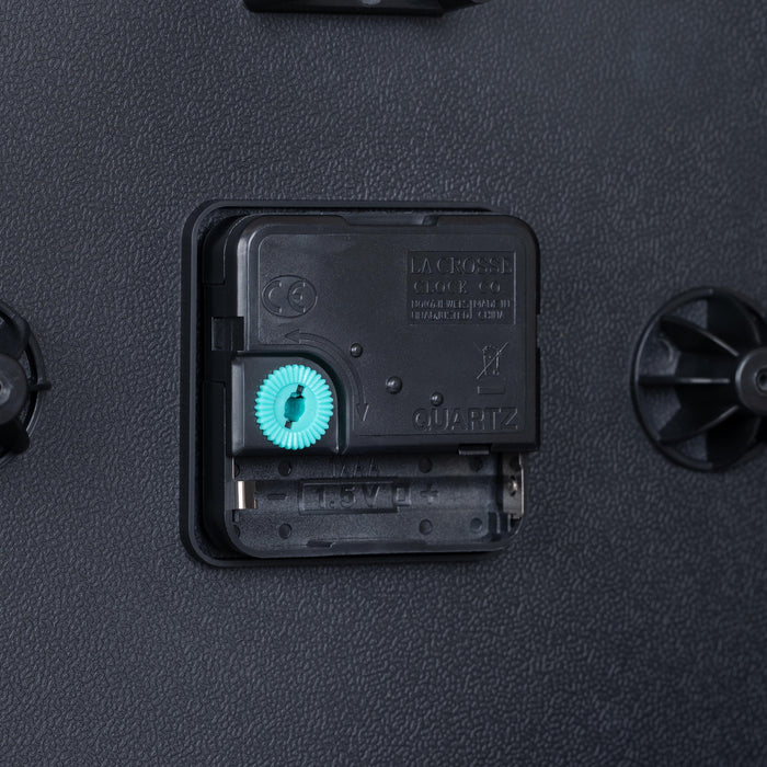 Close-up image of the battery compartment for the 404-3025S 10-inch Basics Wall Clock - Silver with Quartz movement and an easy set time wheel.