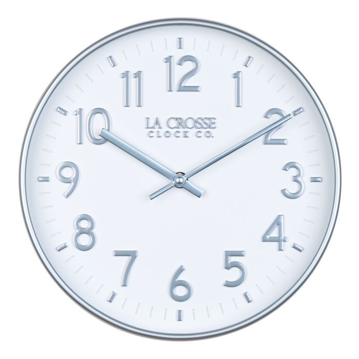 Head on view of view of the 404-3027B Tovi modern wall clock showing a white dial with silver Arabic numbers and a flush mount silver case  and matching silver hour and minute hands