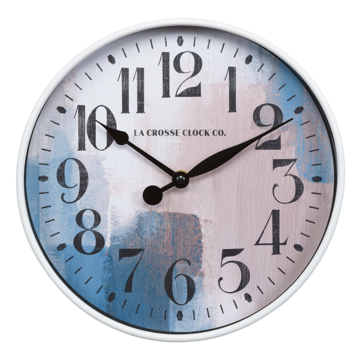 Head on image of the Brushstroke 404-3028A 11 inch wall clock with a white case surrounding a painted brush design dial in blues creams and taupe black numbers and black metal hands