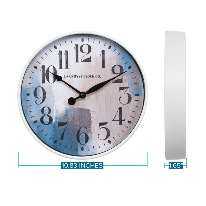 Dimensions of the Brushstroke 404-3028A 11 inch wall clock with a white case surrounding a painted brush design dial in blues creams and taupe black numbers and black metal hands showing the depth of the case with a side view