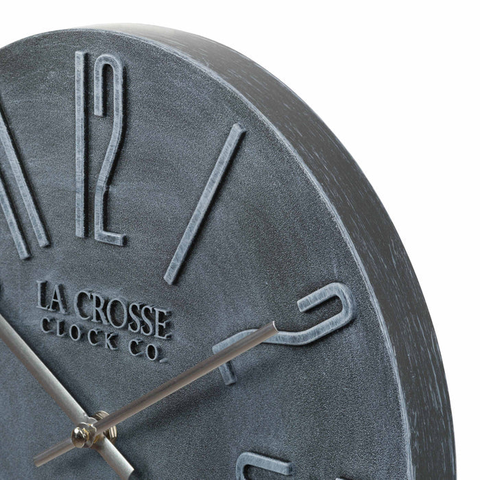 Close up of the 404-3028B Cormac 11 inch open face molded dark gray wall clock with numbers in relief and silver metal hour and minute hands