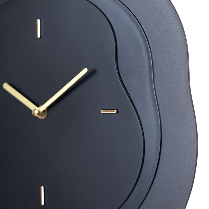 Close-up frame image of the 404-3039B 15.2-inch Drift Wall Clock – Black featuring the open face multi-layered design with drifting contours, metal hands, and raised number markings in a brass finish.
