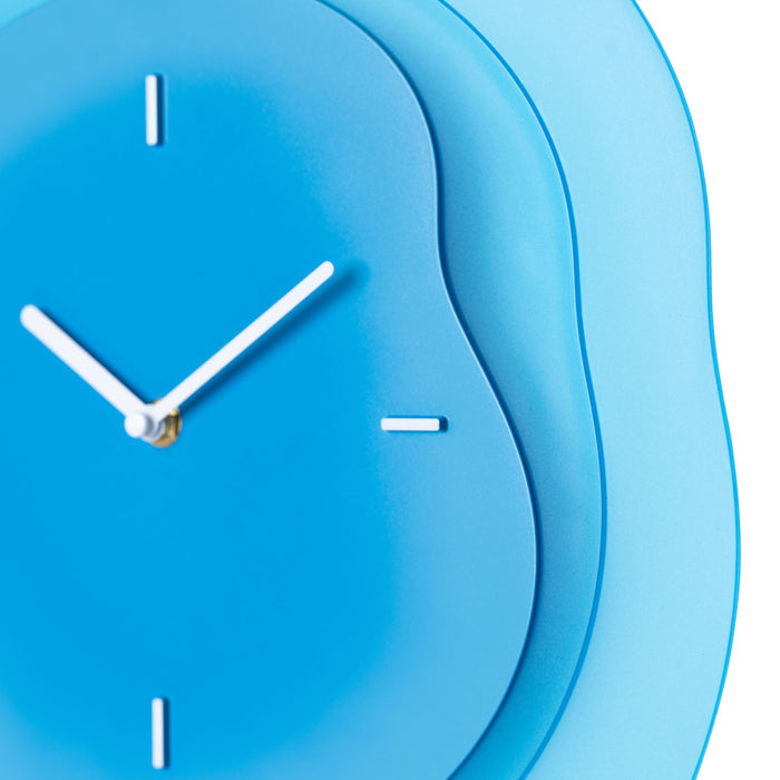 Close-up frame image of the 404-3039BL 15.2-inch Drift Wall Clock – Blue featuring the open face multi-layered design with drifting contours, metal hands, and raised number markings in white.