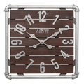 Head-on image of the 404-3412L 16-inch Foundry Metal & Wood Wall Clock - Light. The clock features a square metal pipe frame in a weathered pewter finish, a truffle-brown-stained wood slat clock face with pewter-finished metal numbers and hands.