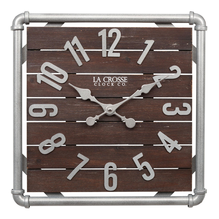 Head-on image of the 404-3412L 16-inch Foundry Metal & Wood Wall Clock - Light. The clock features a square metal pipe frame in a weathered pewter finish, a truffle-brown-stained wood slat clock face with pewter-finished metal numbers and hands.