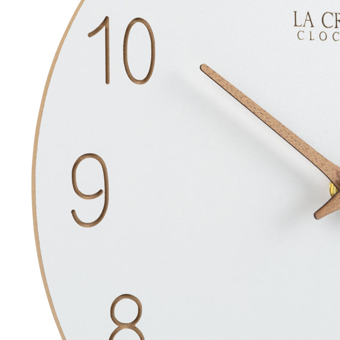 Close-up image of the laser-cut numbers and the wood hour and minute hands of the 404-3630B 12-inch Sierra Wood Wall Clock – White.