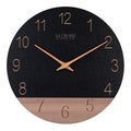 Head-on image of the 404-3630C 12-inch Sierra Wood Wall Clock - Black, the clock features a black and wood split design open-face dial, with laser cut numbers, and wood hour and minute hands.