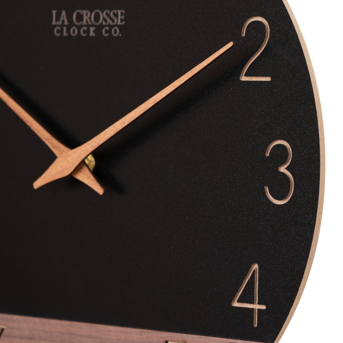 Close-up frame detail of the 404-3630C 12-inch Sierra Wood Wall Clock - Black, the clock features a black and wood split design open-face dial, with laser cut numbers, and wood hour and minute hands.