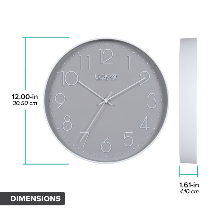 Orthographic image of the 404-3831 12-inch Paxton Wall Clock - Gray, with Silent Sweep, featuring a flush-mount gray frame, a matching color dial, white raised numbers, and white metal hour, minute, and second hands. The diameter is 12 inches, and the depth is 1.61 inches.