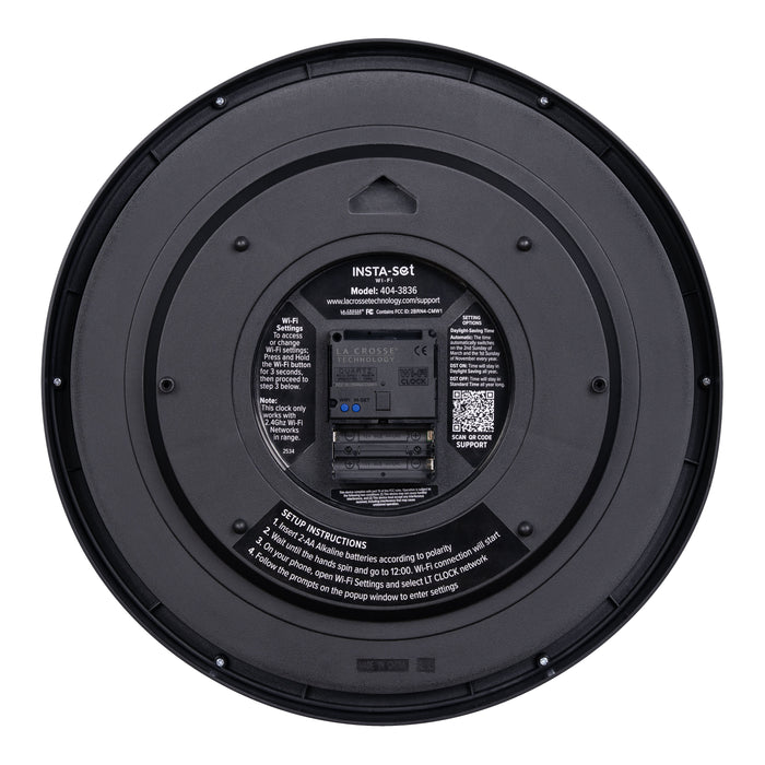 Back view showing the battery compartment with instructions and a QR code of the 404-3836 Insta-Set Wi-Fi Analog Wall Clock in black plastic and white text