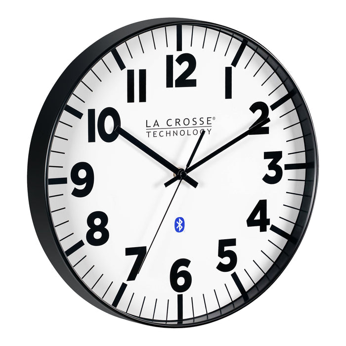 Right-facing image of the 404-4536 14.2-inch Insta-Set Wall Clock with Bluetooth® Technology the clock features a white dial with bold black numbers and markings, a black flush-mount frame, and black hands.
