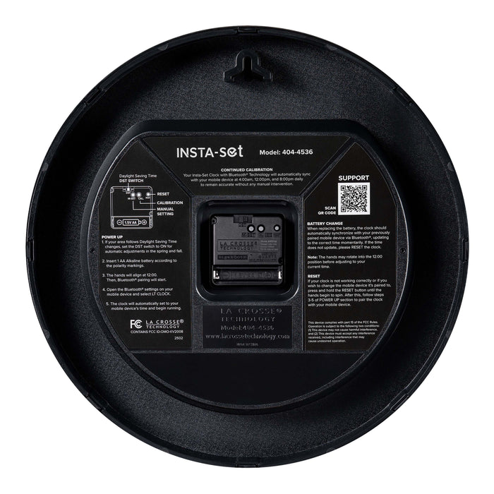 Back image of the 404-4536 14.2-inch Insta-Set Wall Clock with Bluetooth® Technology showing the battery compartment, the quartz movement, the hanging hole, and instructions for operation of the Insta-Set technology.