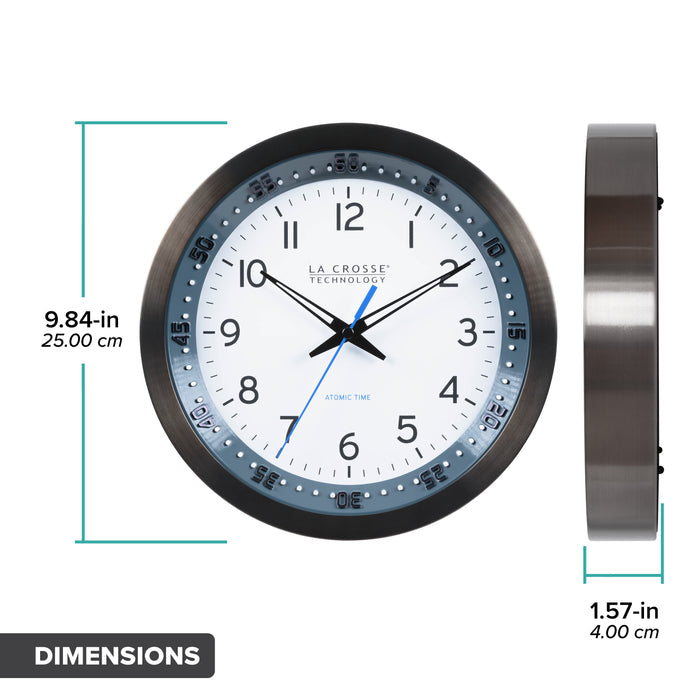 Dimension image of the 404-54667 Atomic Metal Wall Clock with Blue Chapter Ring. The text dimensions of 9.84 inches in diameter and a depth of 1.57 inches is displayed. The clock features a black stainless steel frame with a blue chapter ring and raised seconds indicators, surrounding a white dial with black numbers, metal hands, and a blue accent second hand.