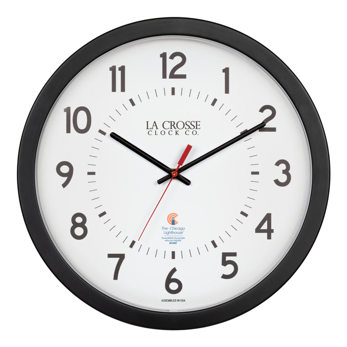 Head-on image of the 404-5537 14.5-inch Wall Clock with black bold numbers, black hour and minute hands, and a red second hand. Two logos apear on the clock, 
La Crosse Clock Co. and Chicago Lighthouse industries - a partner that employs the blind to bring this classic wall clock to consumers.