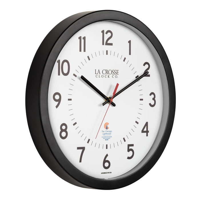 Right-facing image of the 404-5537 14.5-inch Wall Clock with black bold numbers, black hour and minute hands, and a red second hand. Two logos apear on the clock, 
La Crosse Clock Co. and Chicago Lighthouse industries - a partner that employs the blind to bring this classic wall clock to consumers.