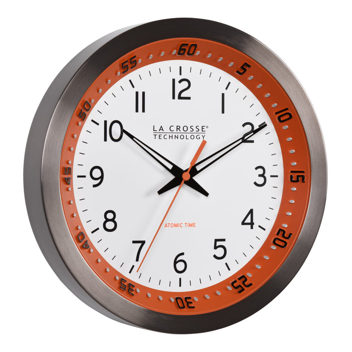 Right-facing image of the 404-87696 10-inch Atomic Metal Wall Clock - Chapter Ring: Orange. The clock features a white dial, an orange chapter ring with seconds indicator, black hands, an orange second hand, and a stainless steel flush-mount frame.