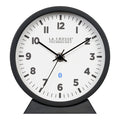 Head-on image of the 437-3816 Insta-Set Table/Wall Clock with Bluetooth® Technology featuring a white dial with bold black numerals, black metal hands, and a black frame with removable base for tabletop or wall hanging placement.