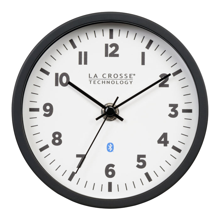Head-on image of the 437-3816 Insta-Set Table/Wall Clock with Bluetooth® Technology featuring a white dial with bold black numerals, black metal hands, and a black frame with the base removed for wall hanging placement.