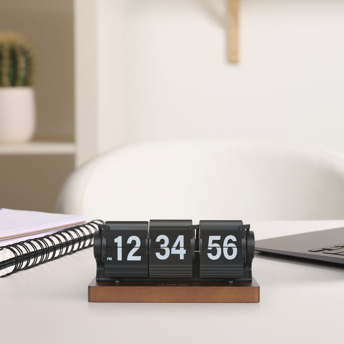 Black Flip Alarm Clock 536-526B sitting on a desk