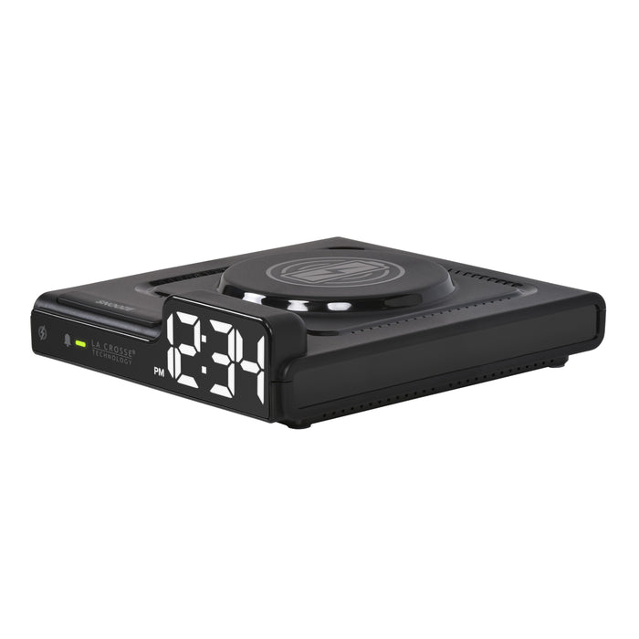 Left-facing image of the 617-143 Amp Mini 15W Wireless Charging LED Alarm Clock. The alarm clock features a wireless charging pad, easy access buttons, an alarm with snooze, white time digits, and LED status light.