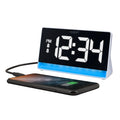 Left-facing image of the 617-149 Digital Alarm Clock with Color Changing Glow Light shown with a smartphone plugged in to be charged. The alarm clock features a white case, a color-changing bar as the base, and a black display with white digits.