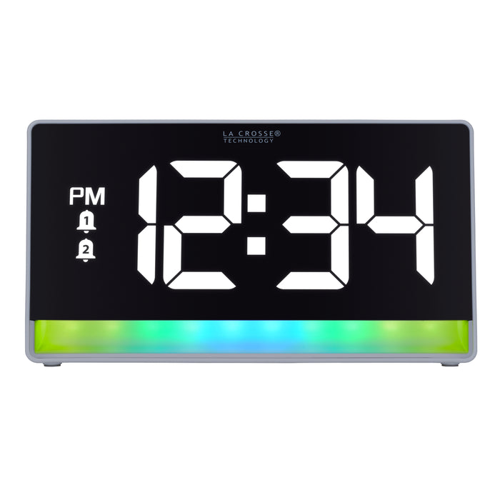 Hed-on image of the 617-149 Digital Alarm Clock with Color Changing Glow Light, the alarm clock features a white case, a color-changing bar at the base shown in blues and greens, and a black display with white digits.