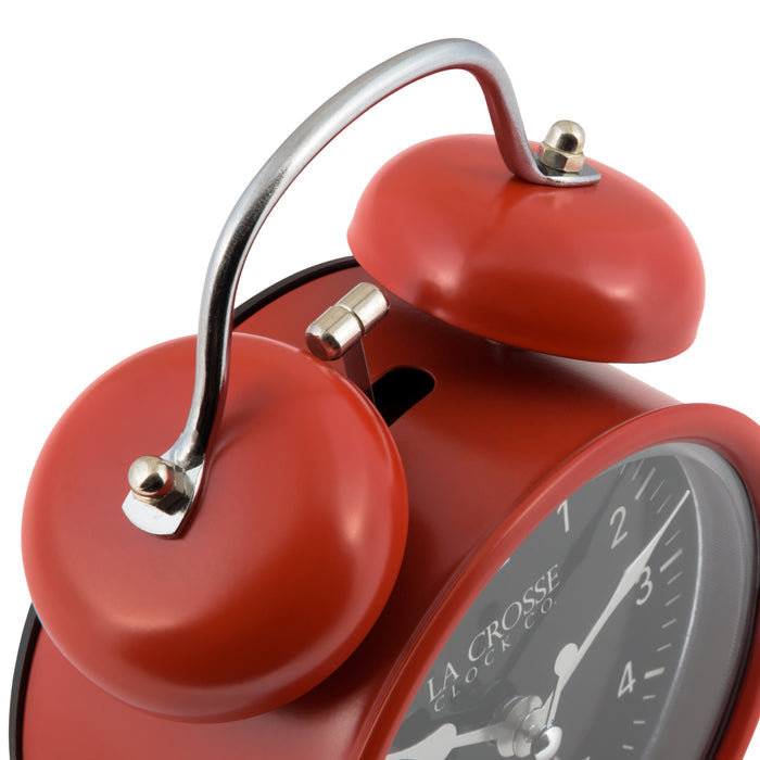 Detail shot of the twin bells of the 617-3314 Metal Twin Bell Alarm Clock – Red, the clock features a black dial with white numbers, silver hands and accents, in a red metal case