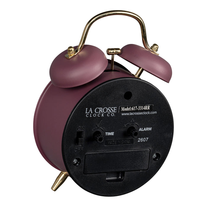 Angled back image of the 617-3314RR Metal Twin Bell Alarm Clock – Ruby Red, showing the battery compartment, knobs, and the on/off switch.