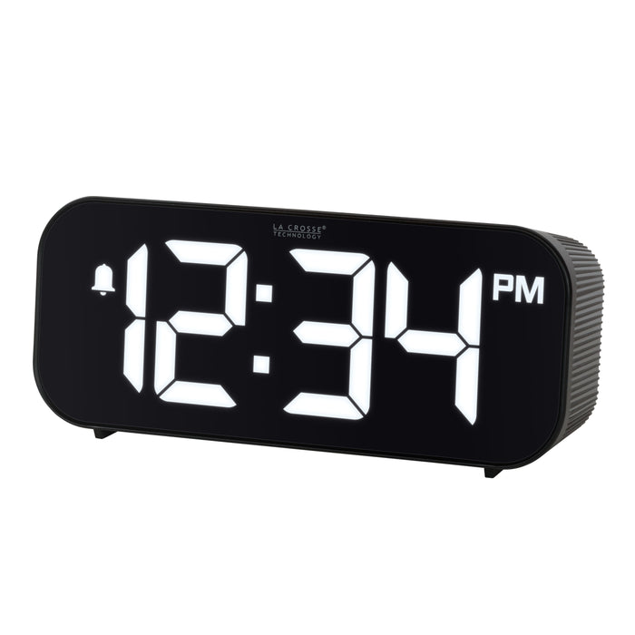 Left-facing image of the 617-714 Insta-Set Digital LED Alarm Clock with Bluetooth® Technology - Black. The alarm clock features large white digits, a PM indicator, and an alarm icon in a black case.