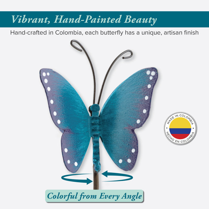 704-71077 Hand-painted butterfly with blue wings on a white background, featuring Colombian craftsmanship.