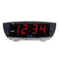 Head-on image of the 75908 0.9-inch Red LED Clear Case Alarm Clock. The digital alarm clock features red digits with a black lens, PM and ALARM indicators, and is in a clear case.