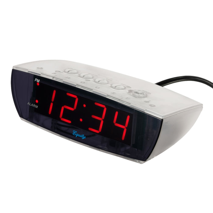 Angled view left-facing image of the 75908 0.9-inch Red LED Clear Case Alarm Clock. The digital alarm clock features red digits with a black lens, PM and ALARM indicators, and is in a clear case.